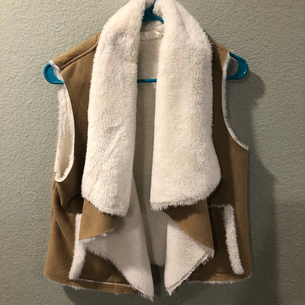 Tan vest with white fur inside